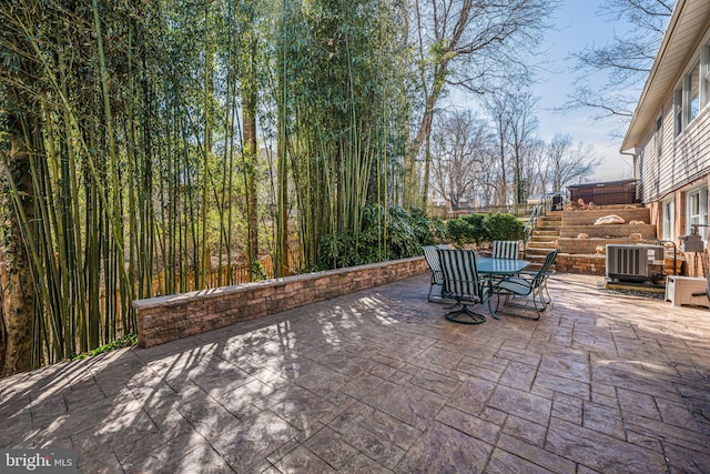 view of patio / terrace featuring outdoor dining space and central AC unit