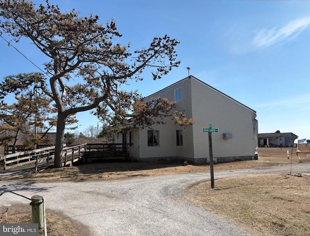 view of side of home with fence