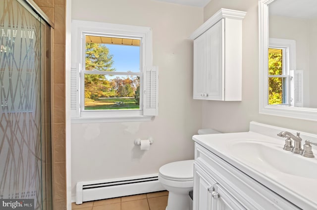 bathroom featuring toilet, baseboard heating, a stall shower, vanity, and tile patterned floors