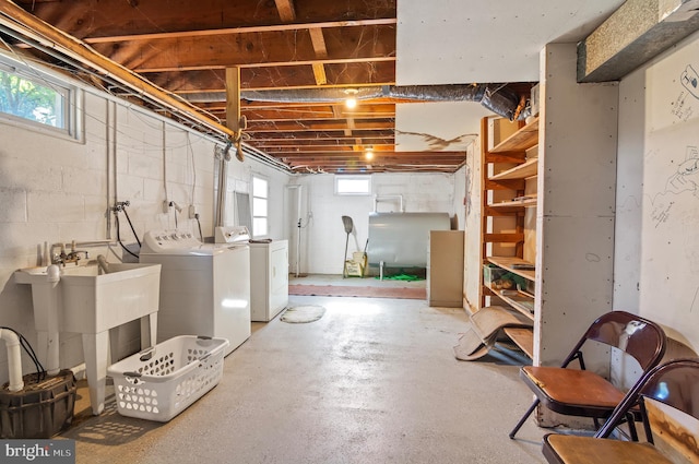 below grade area featuring washer and dryer and a healthy amount of sunlight