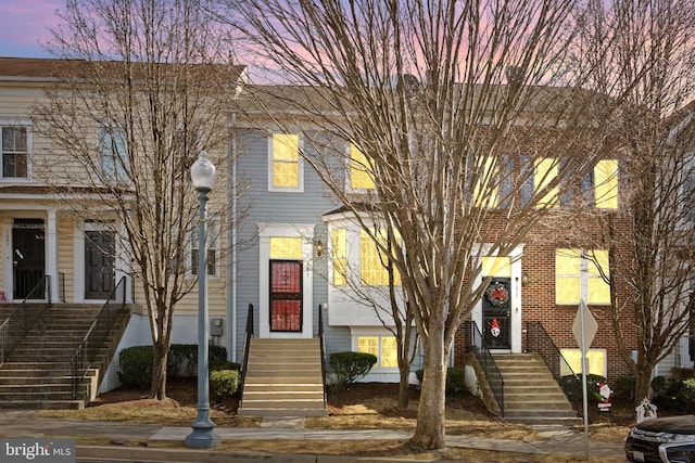 view of property with brick siding