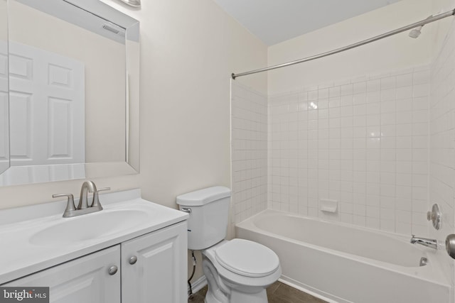 full bath featuring shower / bath combination, visible vents, vanity, and toilet