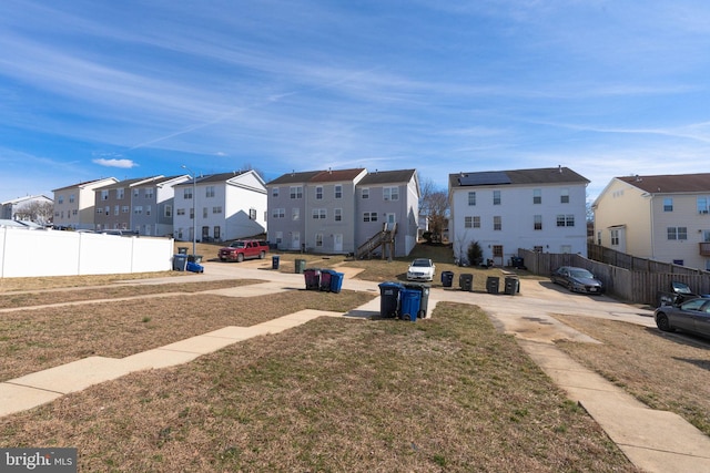 view of road with sidewalks and a residential view