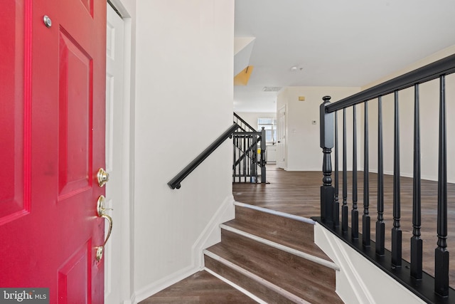 entryway featuring stairs and wood finished floors