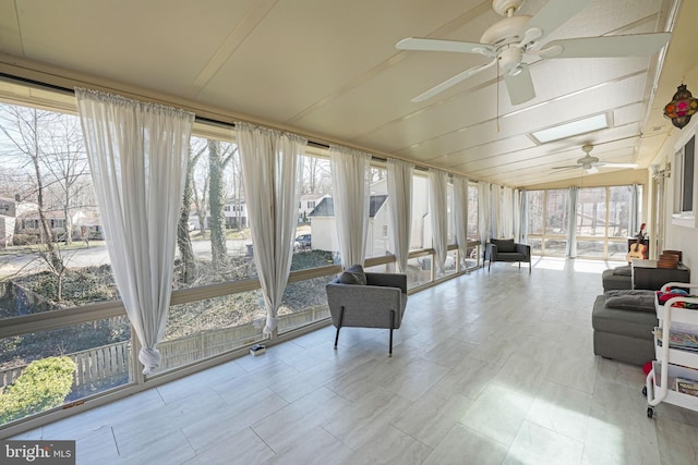 sunroom with a ceiling fan