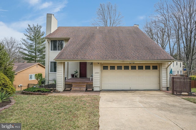 view of front of home with an attached garage, a chimney, driveway, and a front yard