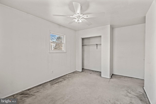 unfurnished bedroom featuring carpet floors, ceiling fan, and a closet