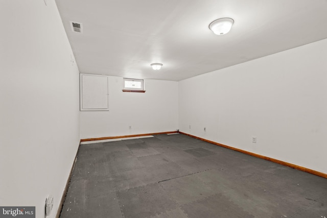 spare room featuring baseboards and visible vents