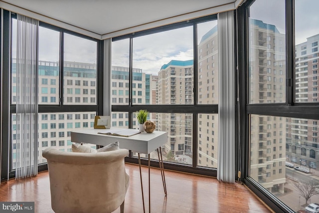 sunroom / solarium featuring a view of city