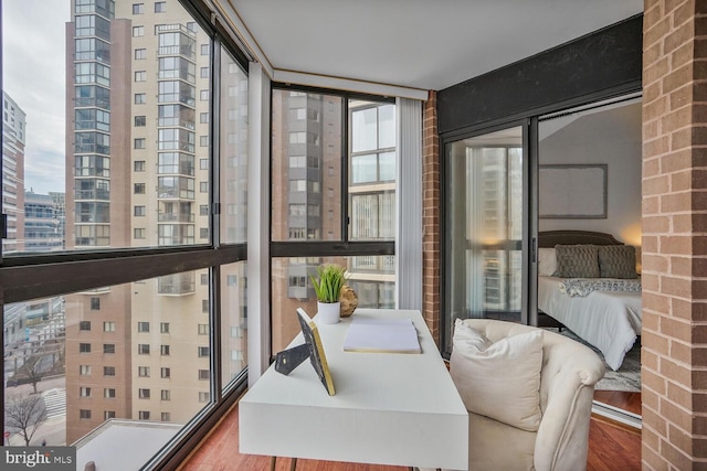 sunroom / solarium with a city view