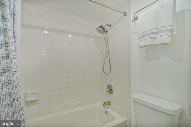 full bathroom featuring shower / tub combo and toilet