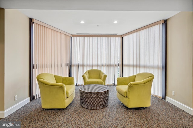 sitting room featuring carpet floors, recessed lighting, and baseboards