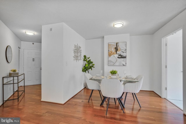 dining room with wood finished floors