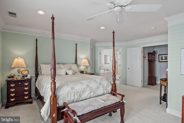 bedroom with light carpet, ensuite bath, visible vents, and ornamental molding