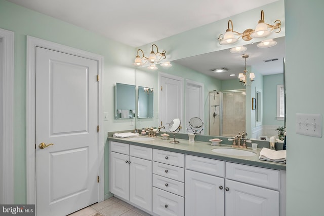 bathroom featuring double vanity, a sink, visible vents, and a shower stall