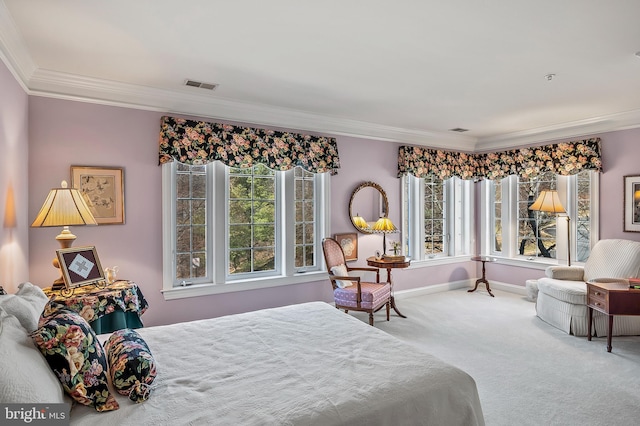 carpeted bedroom featuring ornamental molding, visible vents, and baseboards