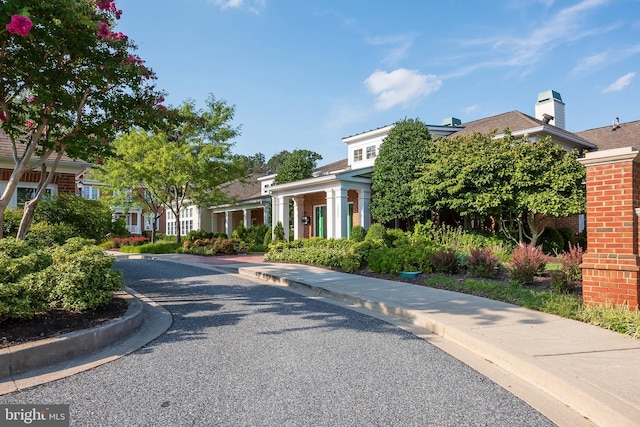 view of road with curbs and sidewalks