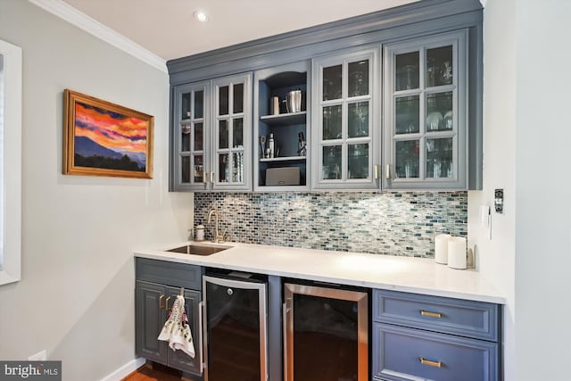 bar with backsplash, wine cooler, wet bar, and a sink