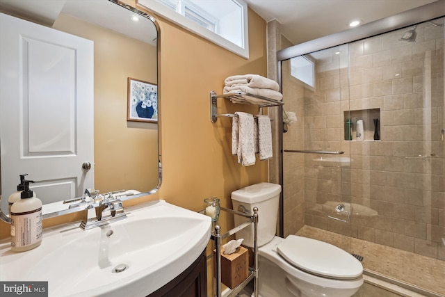 full bathroom with toilet, a shower stall, recessed lighting, and vanity