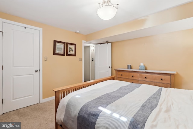 bedroom featuring baseboards and light colored carpet