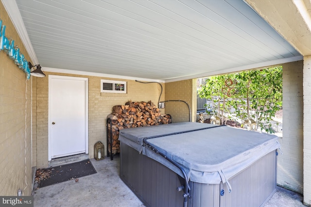 view of patio / terrace featuring a hot tub