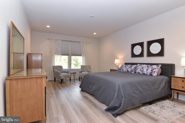 bedroom with light wood-type flooring and recessed lighting