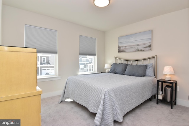 carpeted bedroom with baseboards