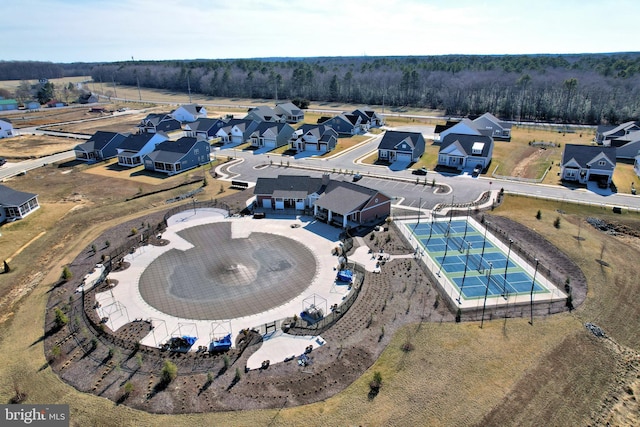 birds eye view of property featuring a residential view and a view of trees