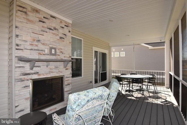 wooden deck featuring outdoor dining space