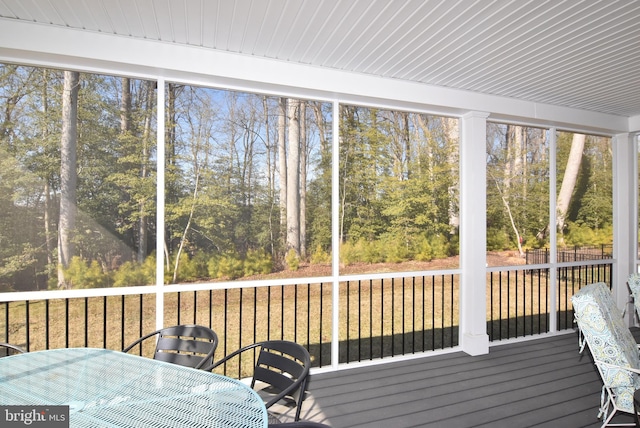 sunroom / solarium with wood ceiling