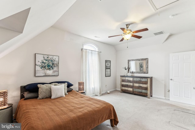 carpeted bedroom with attic access, visible vents, vaulted ceiling, and baseboards