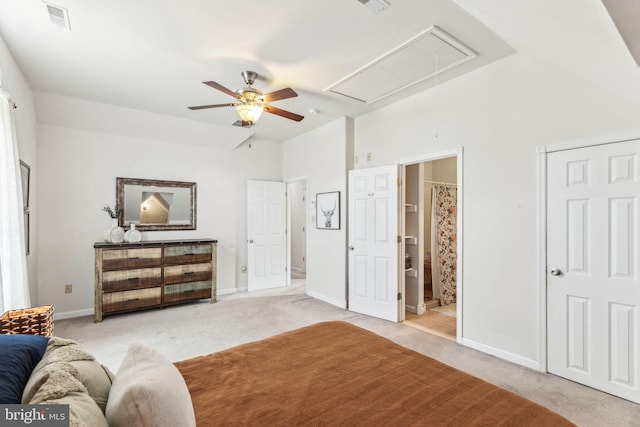 bedroom featuring attic access, light colored carpet, visible vents, and baseboards