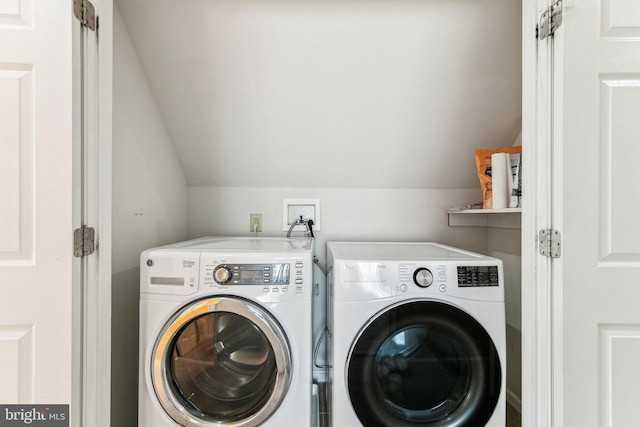 washroom featuring washer and dryer and laundry area