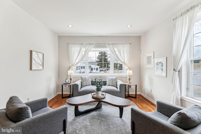 living room with recessed lighting, wood finished floors, and baseboards