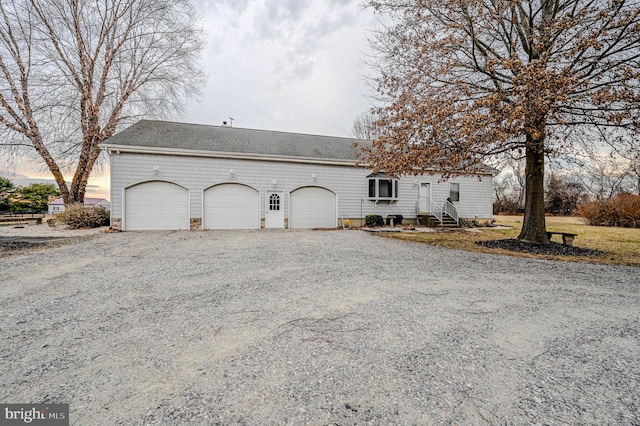 exterior space with gravel driveway