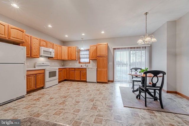 kitchen featuring white appliances, baseboards, an inviting chandelier, a sink, and recessed lighting