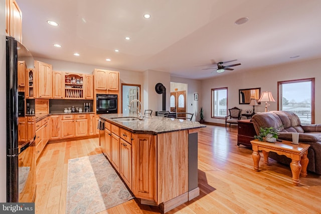 kitchen with open floor plan, black appliances, light brown cabinets, open shelves, and a sink