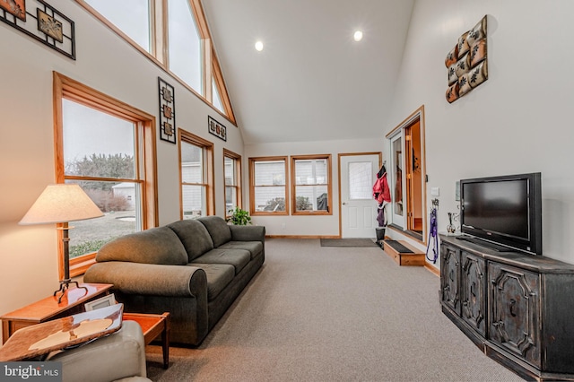 living room featuring high vaulted ceiling, recessed lighting, carpet flooring, and baseboards