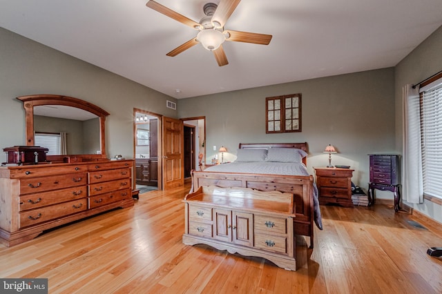 bedroom with visible vents, ceiling fan, and light wood-style flooring