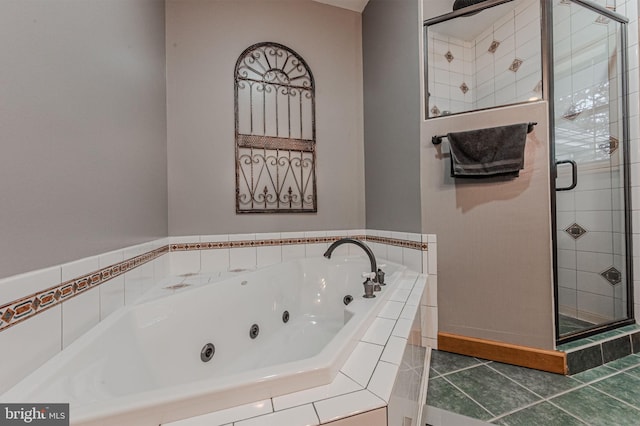 full bath with a stall shower, tile patterned flooring, and a whirlpool tub