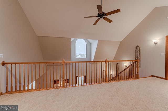 additional living space featuring lofted ceiling, baseboards, ceiling fan, and carpet