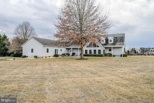 back of house with a yard