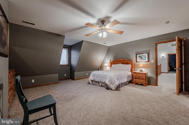 bedroom featuring light carpet, a ceiling fan, visible vents, and baseboards