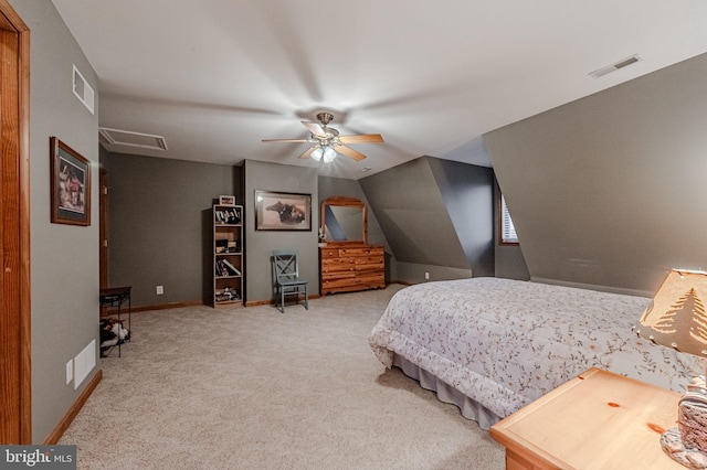 carpeted bedroom featuring baseboards, visible vents, and attic access