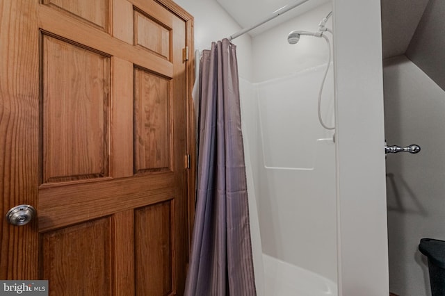 bathroom with a shower with curtain