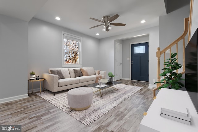 living area featuring ceiling fan, recessed lighting, wood finished floors, and baseboards