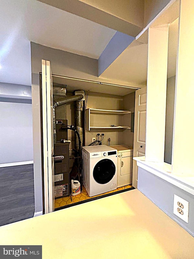 laundry room with washing machine and dryer and laundry area