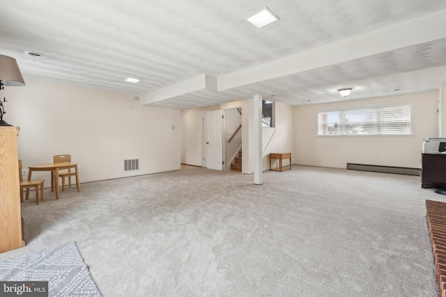 interior space with a baseboard radiator, visible vents, carpet, and stairs