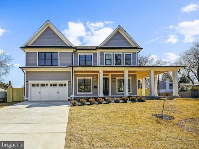 view of front of home featuring a front lawn, fence, concrete driveway, covered porch, and a garage