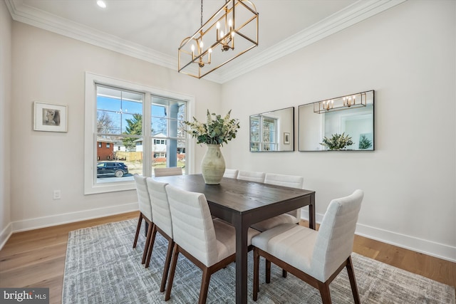 dining area with recessed lighting, wood finished floors, baseboards, and ornamental molding